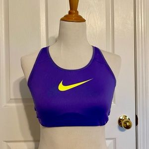 Nike purple sports bra with neon yellow swoosh